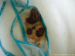 A close-up scene of a woman pooping in her panties, then pulling them down to reveal her load.